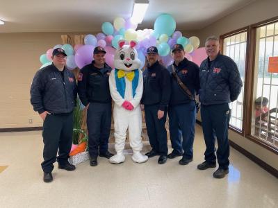 Group of firefighters with the easter bunny